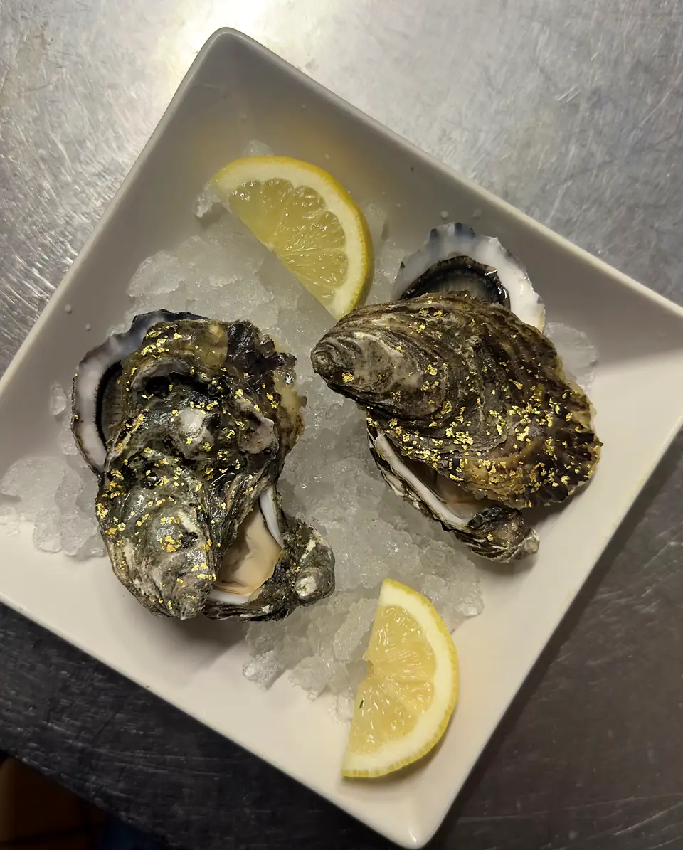 Oysters with gold leaf